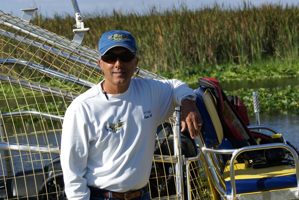 Boat Captain Stands Next to His Airboat